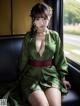 A woman in a green kimono sitting on a train.