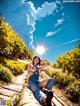 A woman sitting on a wooden walkway in the middle of a field.